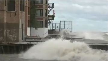 Waves flooding end of street in Rogers Park